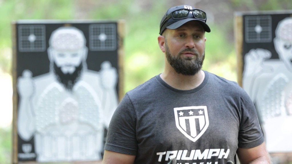 Triumph Systems founder Jared Ogden in front of training targets
